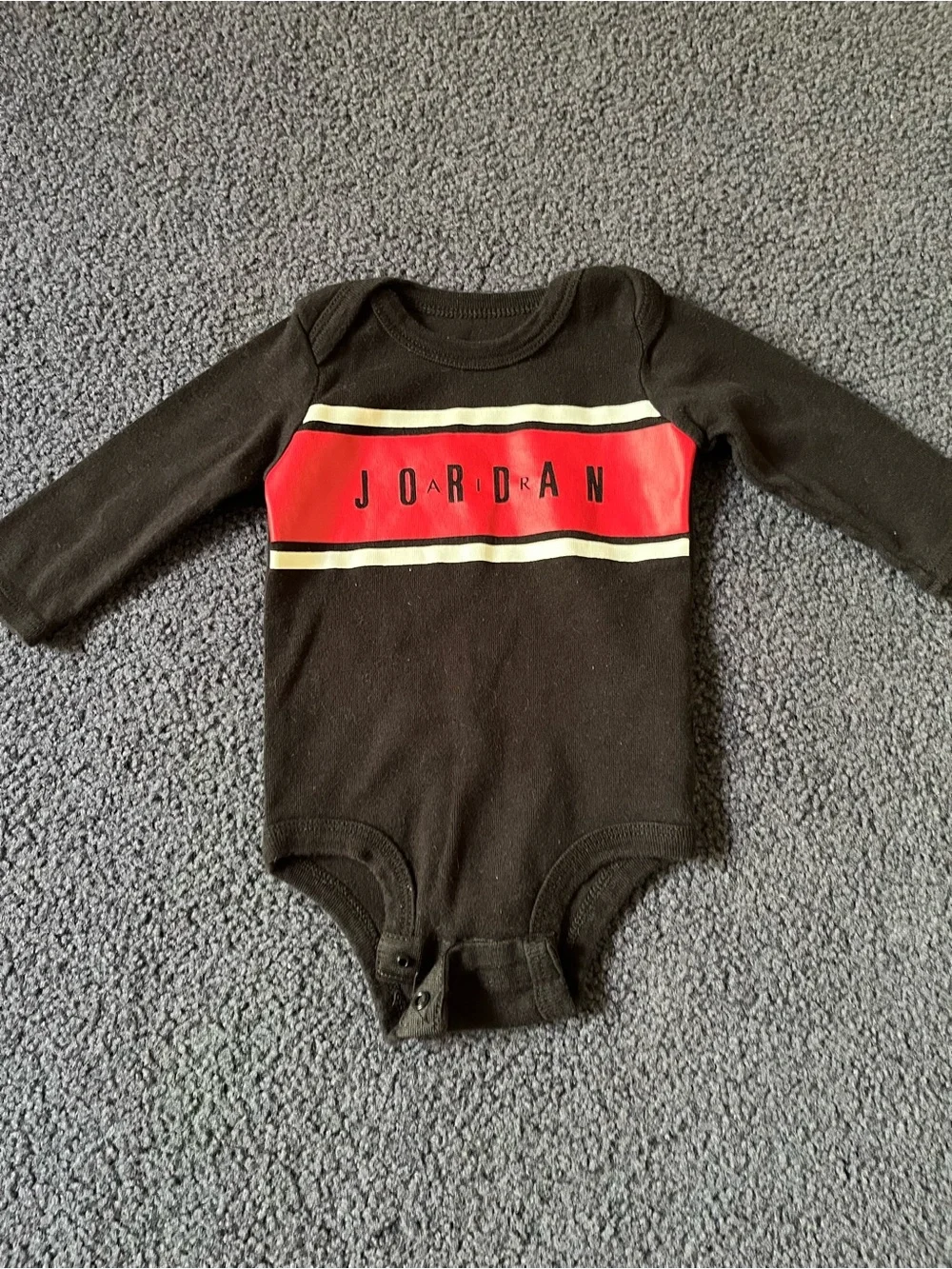 Jordan Black Long-Sleeve Baby Bodysuit with Red Chest Panel